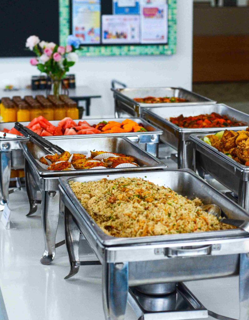 Office Buffet consisting of various cuisines served in silver trays by idocatering 5
