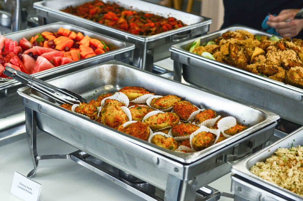 Office Buffet consisting of various cuisines served in silver trays by idocatering 2